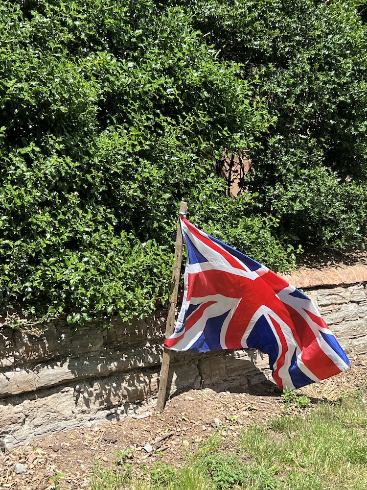 Union Jack Flag hanging fom a village gate