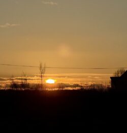 A beautiful sunset over farmland 