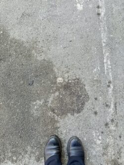 a piece of pavement with a face shape in it. 